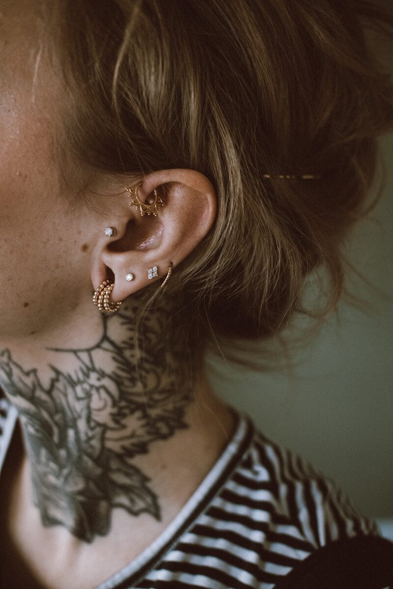 a woman with a tattoo on her ear